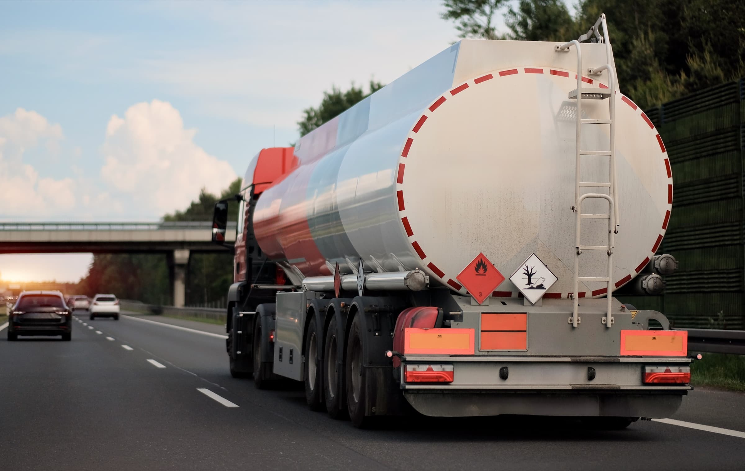 A Gasability fuel tanker on the highway at dusk